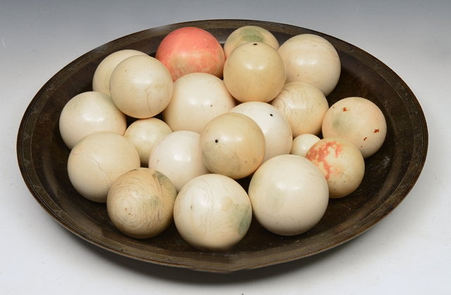 Appraisal: A COLLECTION OF TWENTY ONE VARIOUS TURNED IVORY BILLIARD BALLS