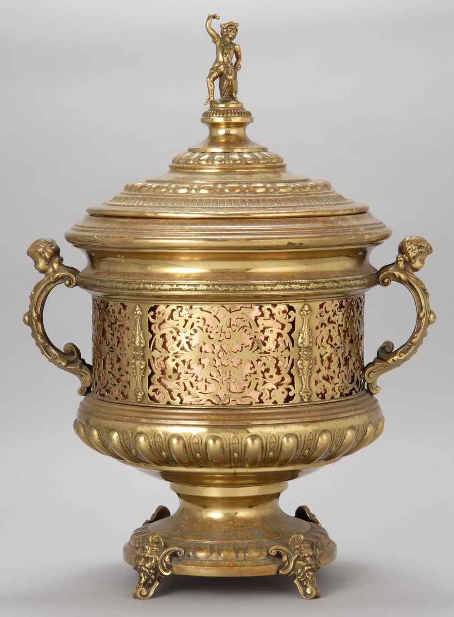 Appraisal: PIERCED BRASS TWO-HANDLED COVERED COAL HOD With pirate-form finial Height