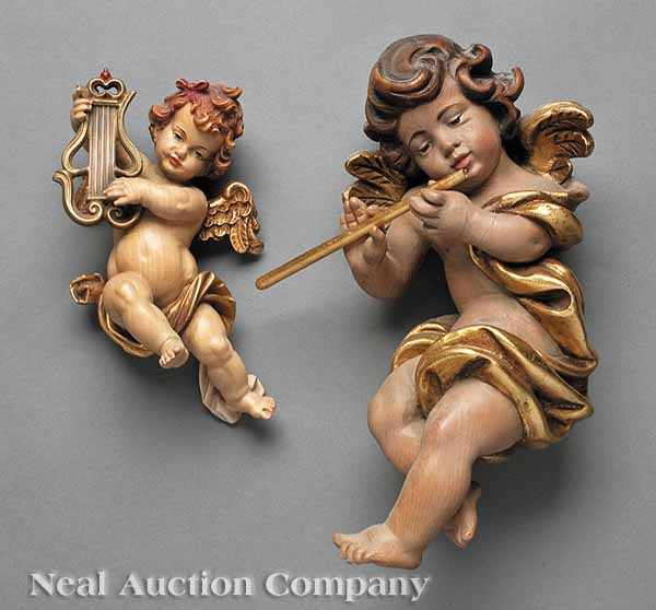 Appraisal: Two Austrian Carved and Painted Wood Cherubs th c one