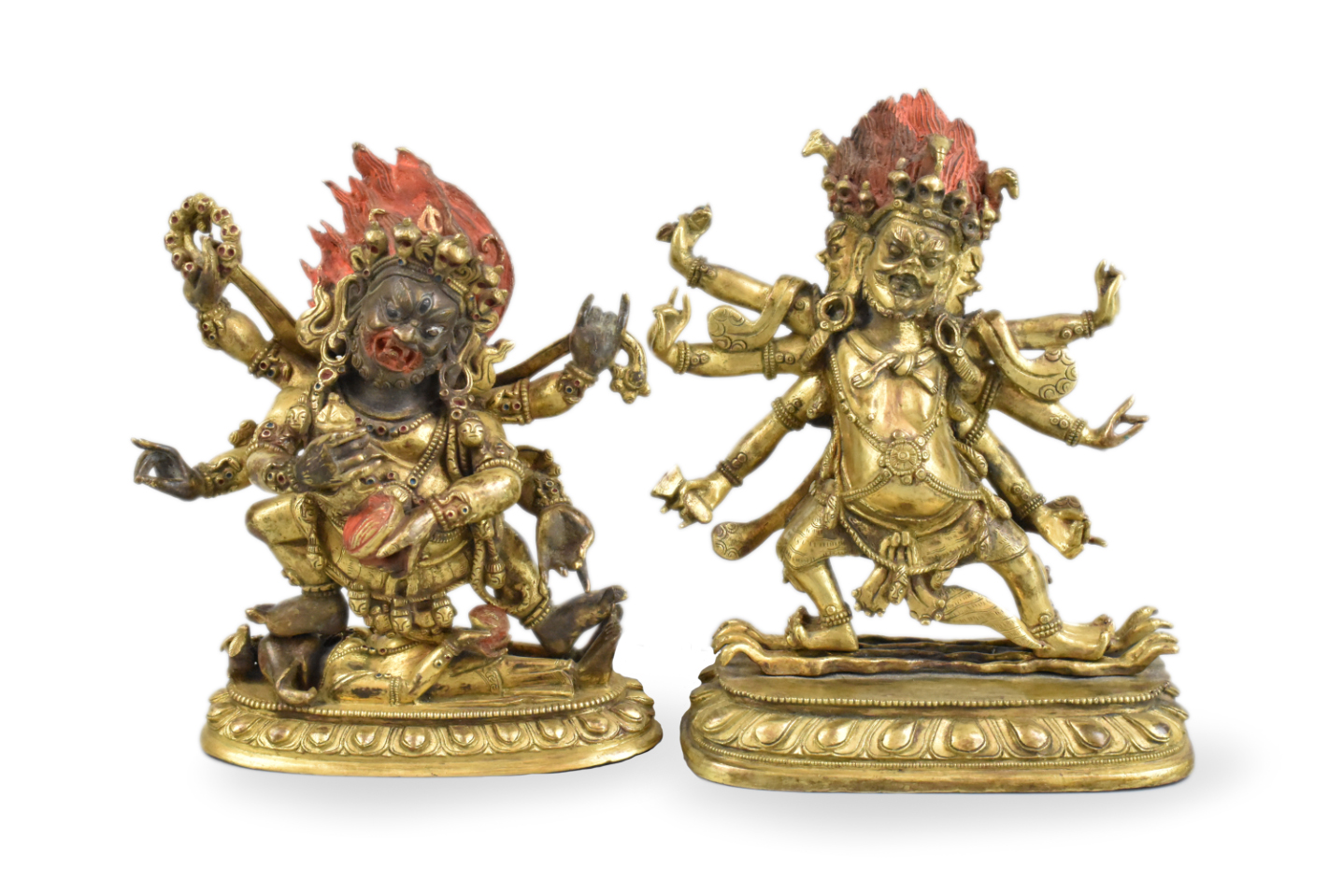 Appraisal: Two Chinese bronze buddha figures each fierce and with multiple