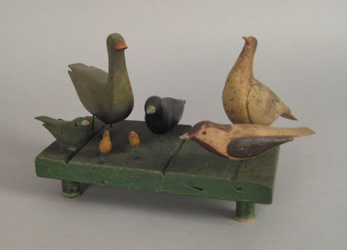 Appraisal: American carved and painted bird group ca h w