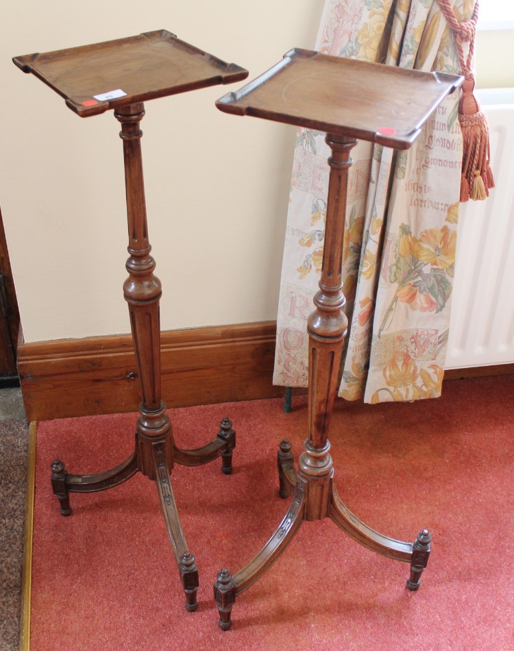 Appraisal: A pair of thC walnut candle stands of French design