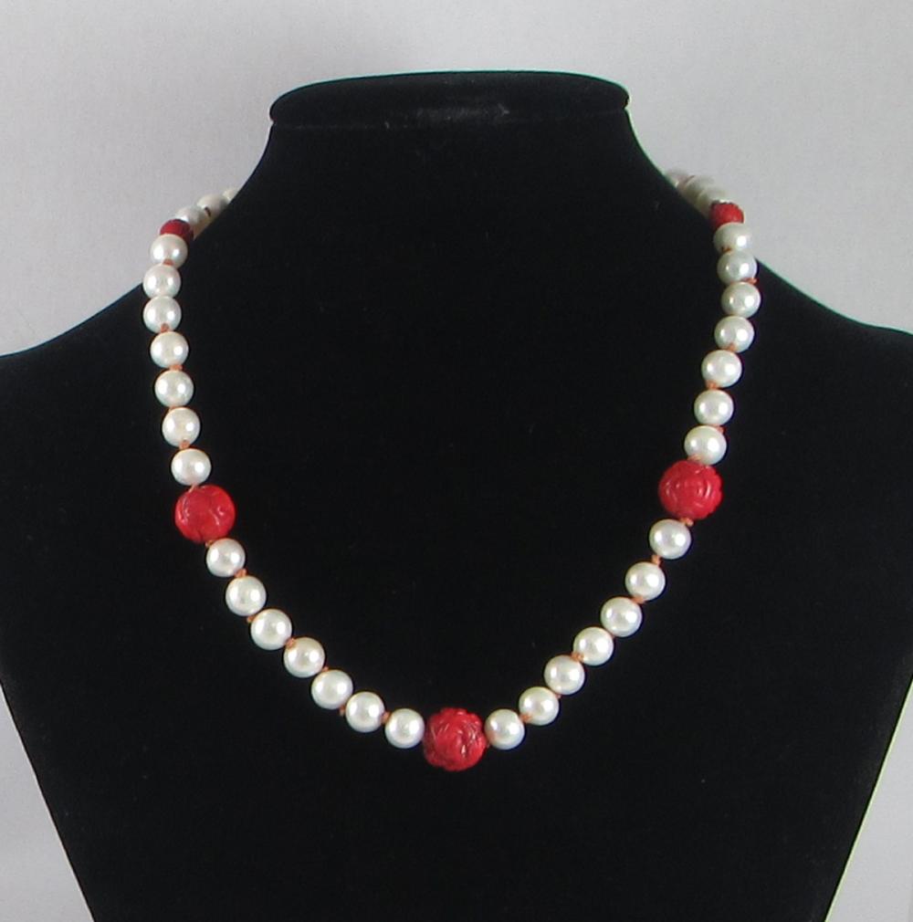 Appraisal: CORAL PEARL AND STERLING SILVER BEAD NECKLACE The hand-knotted necklace