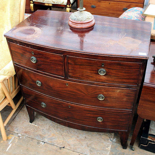 Appraisal: A LATE REGENCY MAHOGANY BOW FRONTED chest of two short