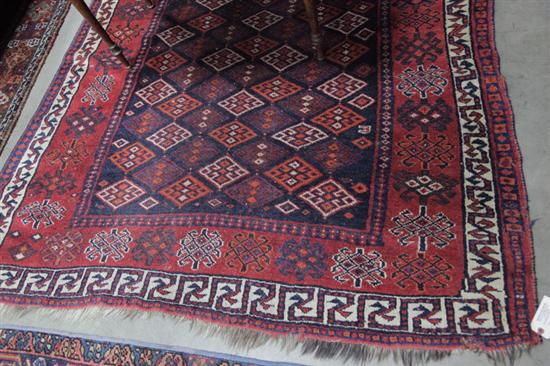 Appraisal: ORIENTAL STYLE RUG Area rug with red ground and repeating