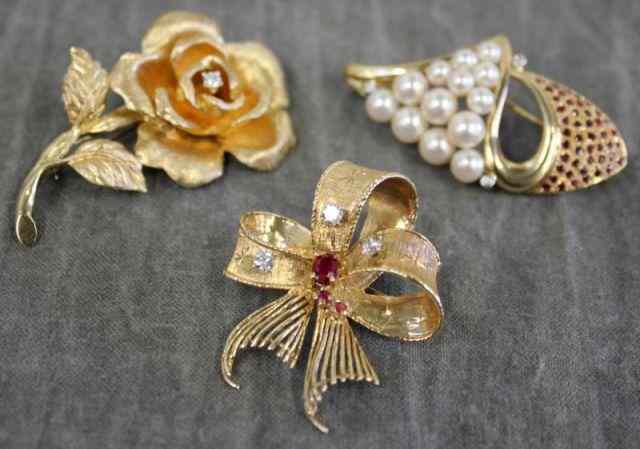 Appraisal: Three kt Gold and Diamond Brooches Includes a kt yellow