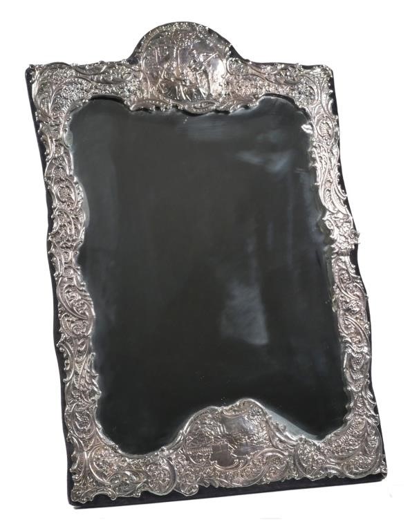 Appraisal: English silver large framed table mirror The silver embossed with