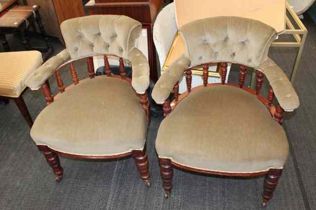 Appraisal: A PAIR OF VICTORIAN OAK LIBRARY CHAIRS with horseshoe shaped