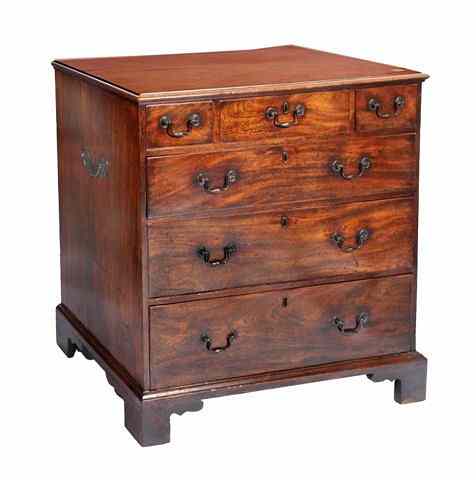 Appraisal: A GEORGE III MAHOGANY STRAIGHT FRONT CHEST of three short