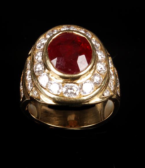 Appraisal: A ruby and diamond cluster ring the central oval mixed