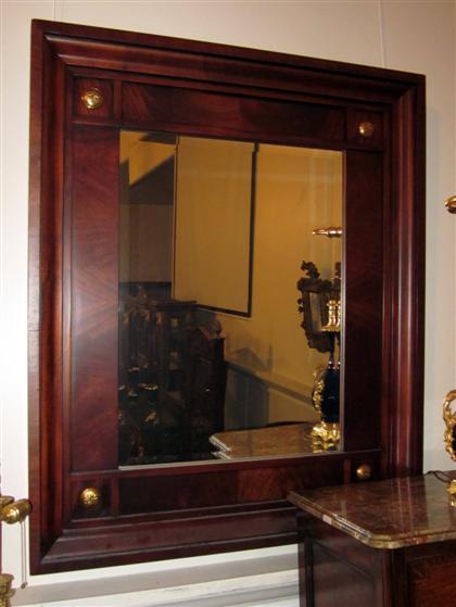 Appraisal: Large Empire style gilt metal mounted mahogany mirrormodern retailed by