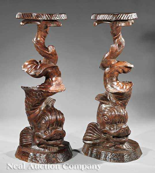 Appraisal: A Pair of Italian Carved Grotto Pedestals stylized dolphins each