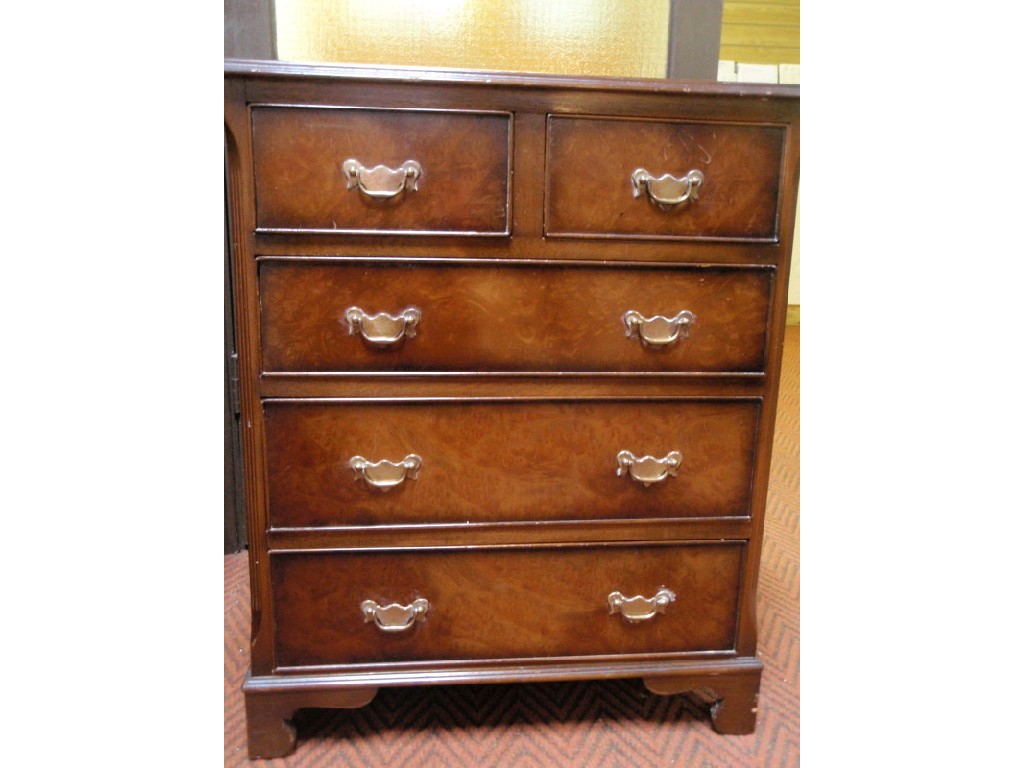 Appraisal: A Georgian style figured walnut chest of two short and