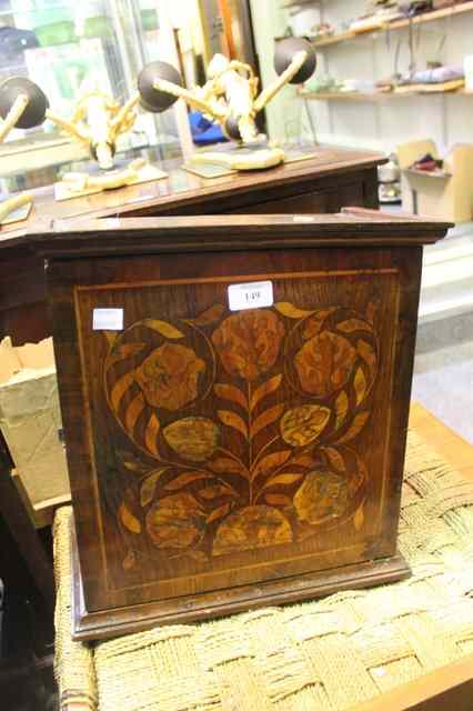 Appraisal: A GEORGIAN OAK MINIATURE CABINET enclosed by a single panel