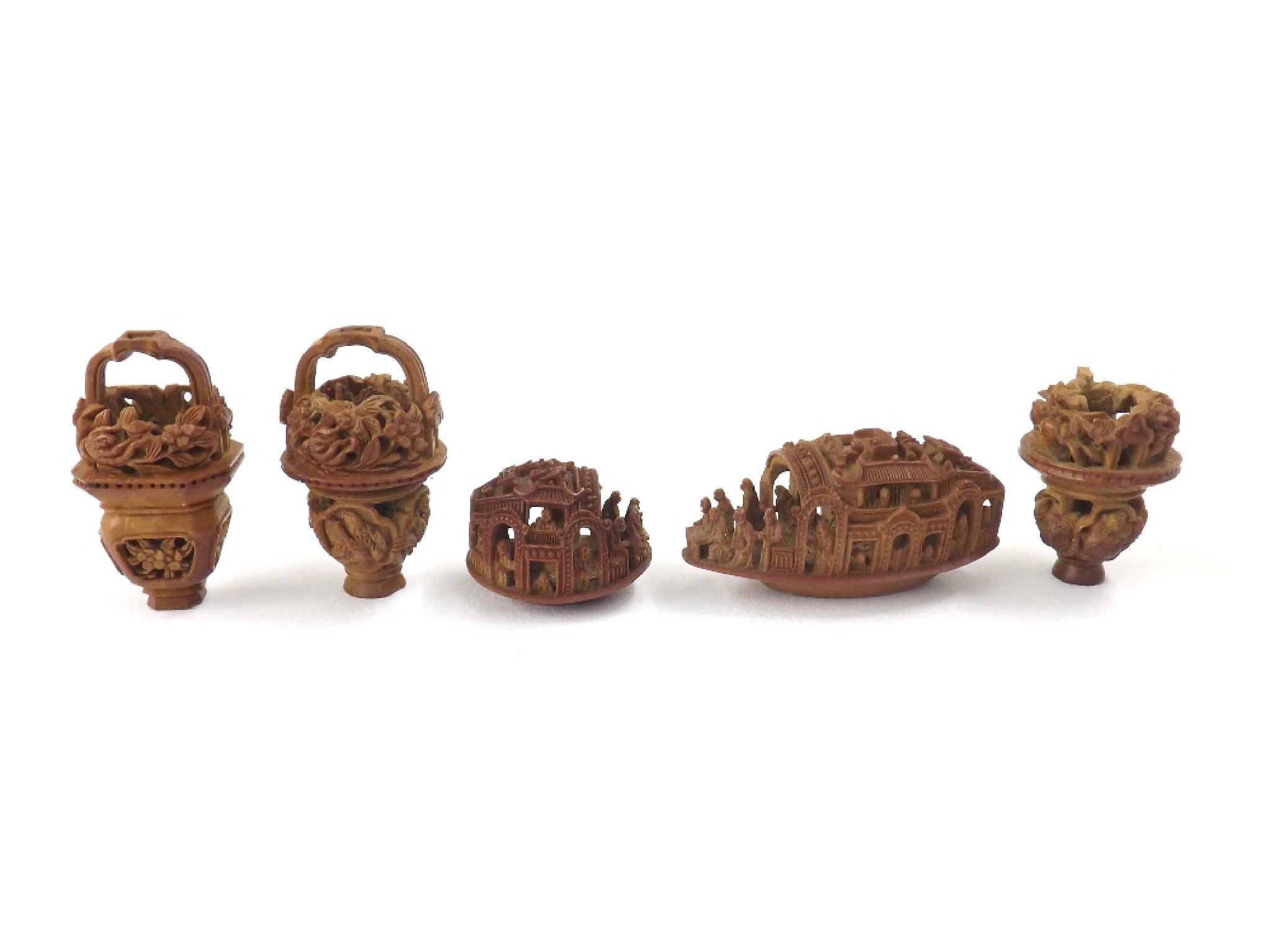 Appraisal: Five Chinese nut carvings to include a longboat scene the