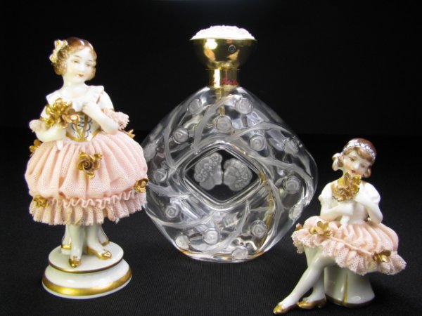 Appraisal: Two hand panted German Dresden little girl figurines holding gold