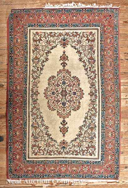 Appraisal: A Semi-Antique Persian Keshan Carpet ivory ground central geometric medallion