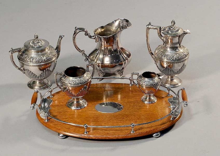 Appraisal: Edwardian four piece plated tea set with oak and silver