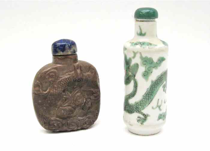 Appraisal: TWO SNUFF BOTTLES with dragon motif a hardstone carved snuff