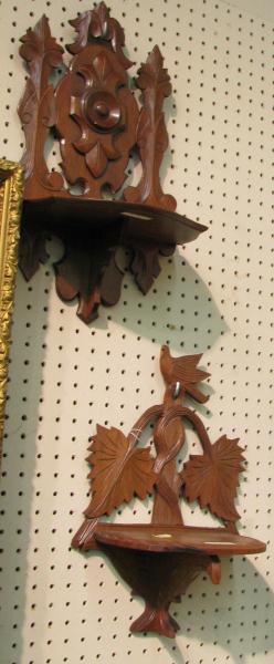 Appraisal: Two Victorian walnut folding wall-mount candle stands one with bird