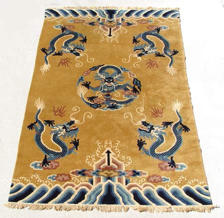 Appraisal: CHINESE DECO CARPET Dragon motif on gold ground Approx '