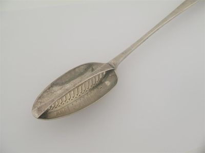 Appraisal: A George III Irish hook-end strainer spoon crested the central