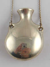 Appraisal: A silver pendant necklace designed as an urn by Tiffany