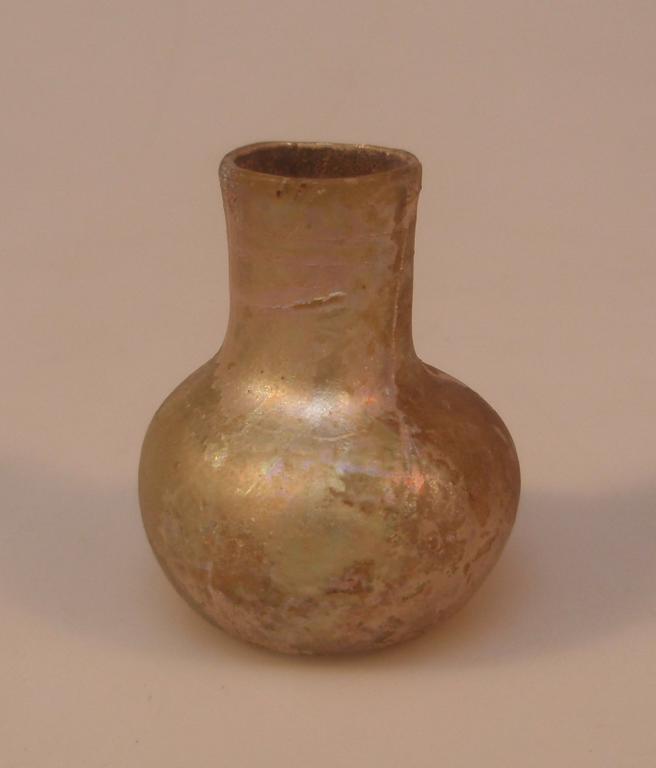 Appraisal: A small post-Roman light green free-blown glass bottle with a