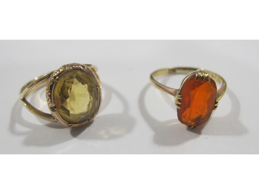 Appraisal: Two gold single stone rings one with fire opal the