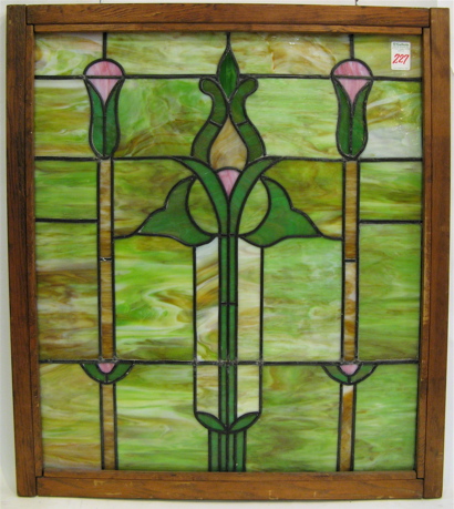 Appraisal: AN AMERICAN STAINED AND LEADED GLASS WINDOW having a stylized