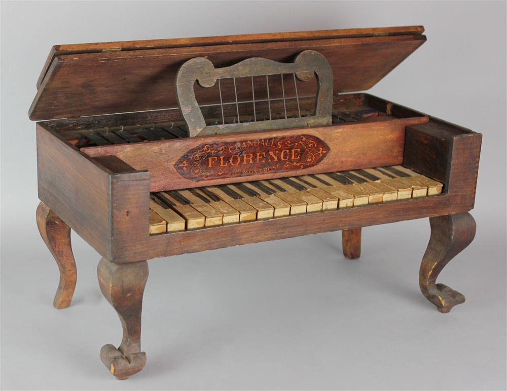 Appraisal: CRANDALL'S FLORENCE OF MONTROSE TOY PIANO decorative label double hinged