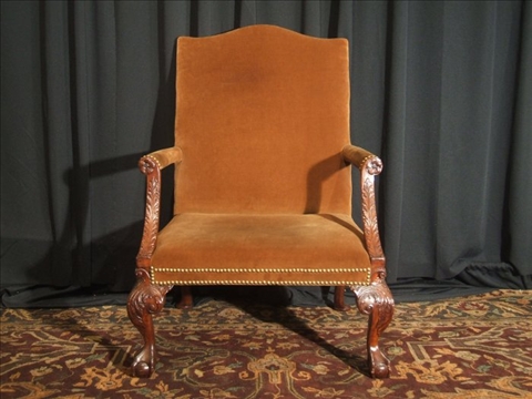 Appraisal: CHIPPENDALE STYLE MAHOGANY LIBRARY CHAIR The rectangular backrest with arched