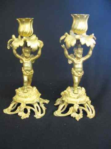 Appraisal: Pair of Dore Bronze Figural Candlesticks cherub decor circa ''