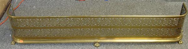 Appraisal: Pierced brass fireplace fender x with set of brass fireplace