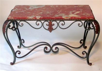 Appraisal: French steel marble top low table The rouge marble top