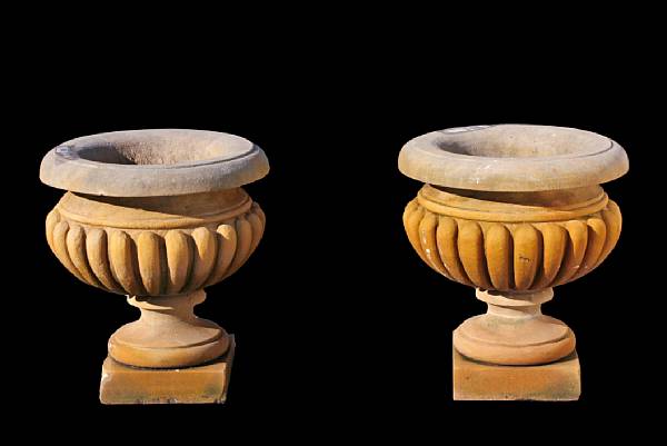 Appraisal: A pair of Baroque style carved limestone urns Each with