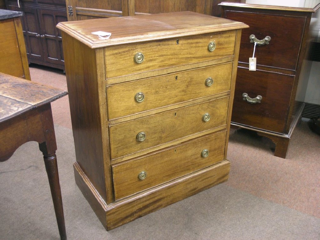 Appraisal: A mahogany chest of drawers four long cock-beaded drawers each