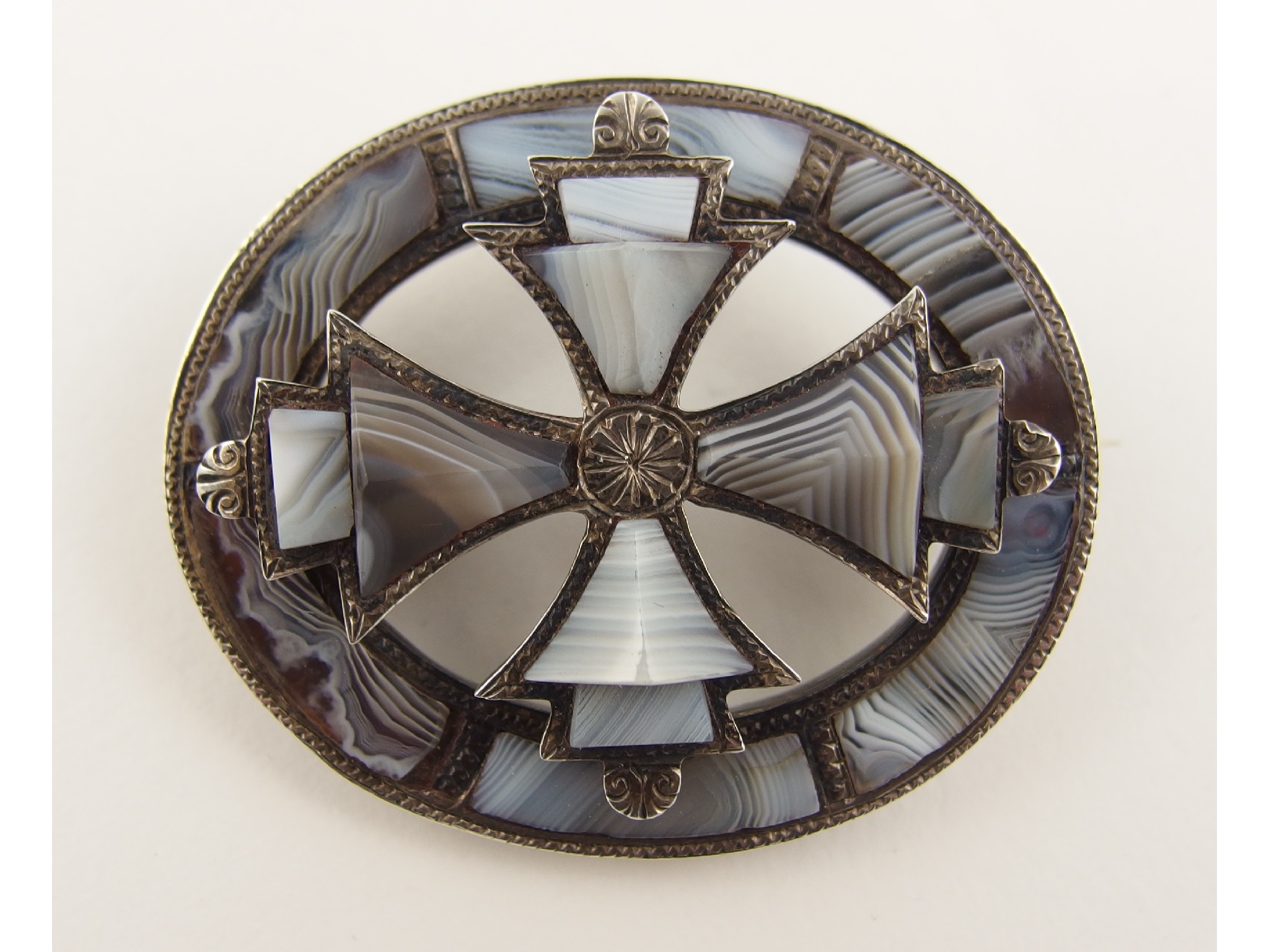 Appraisal: A Scottish agate broochset with carved banded grey lace agates