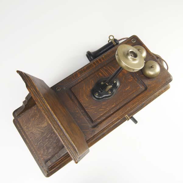 Appraisal: KELLOGG VINTAGE TELEPHONE Wall mounted telephone with oak case marked