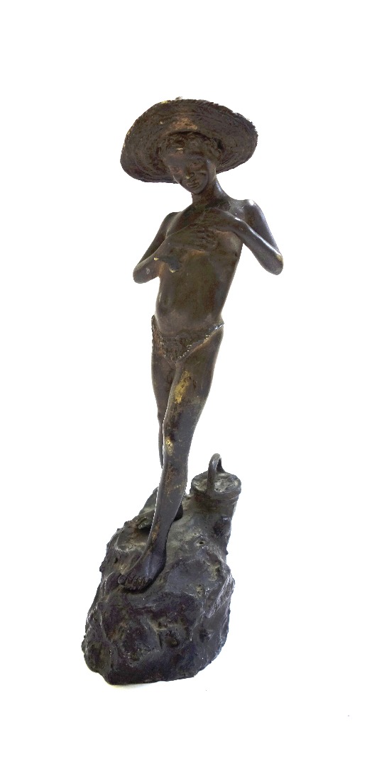 Appraisal: A th century patinated bronze figure of a young boy