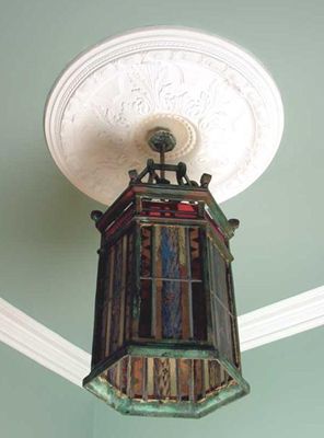 Appraisal: A hexagonal etched and stained glass hall lantern decorated with