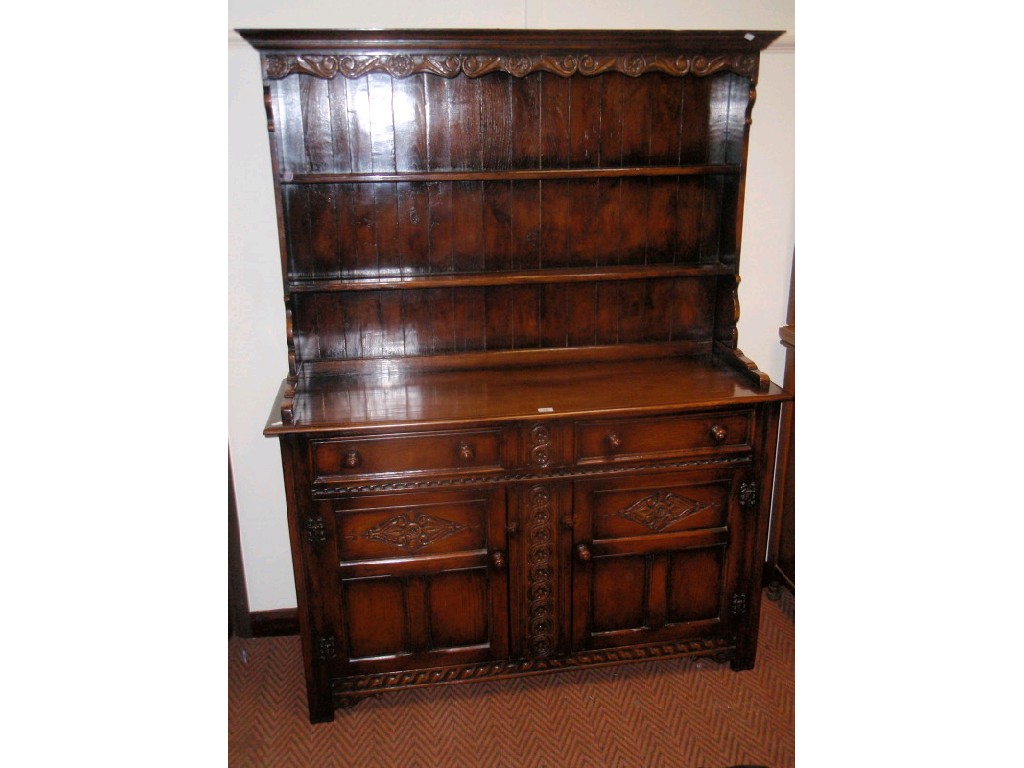 Appraisal: A Maple's traditional oak dresser with plate rack cm wide