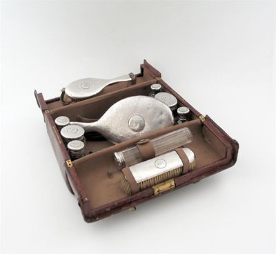 Appraisal: A modern 'Gladstone' type crocodile dressing case fitted with the