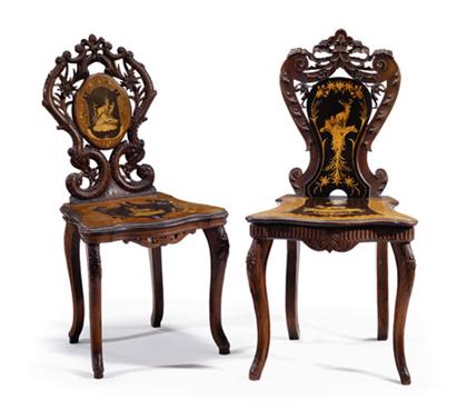 Appraisal: Pair of black forest carved walnut and marquetry hall chairs