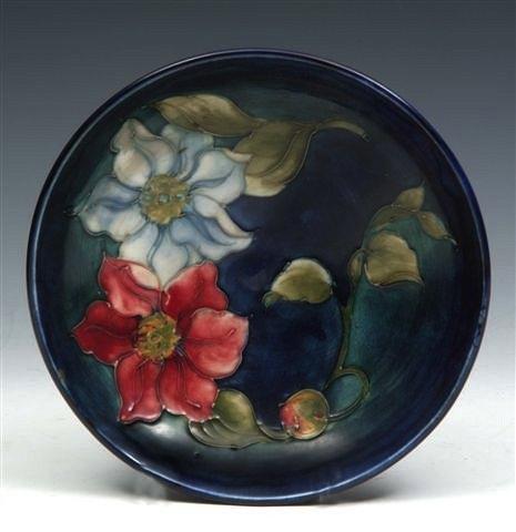 Appraisal: A MOORCROFT BLUE GROUND BOWL decorated with clematis design