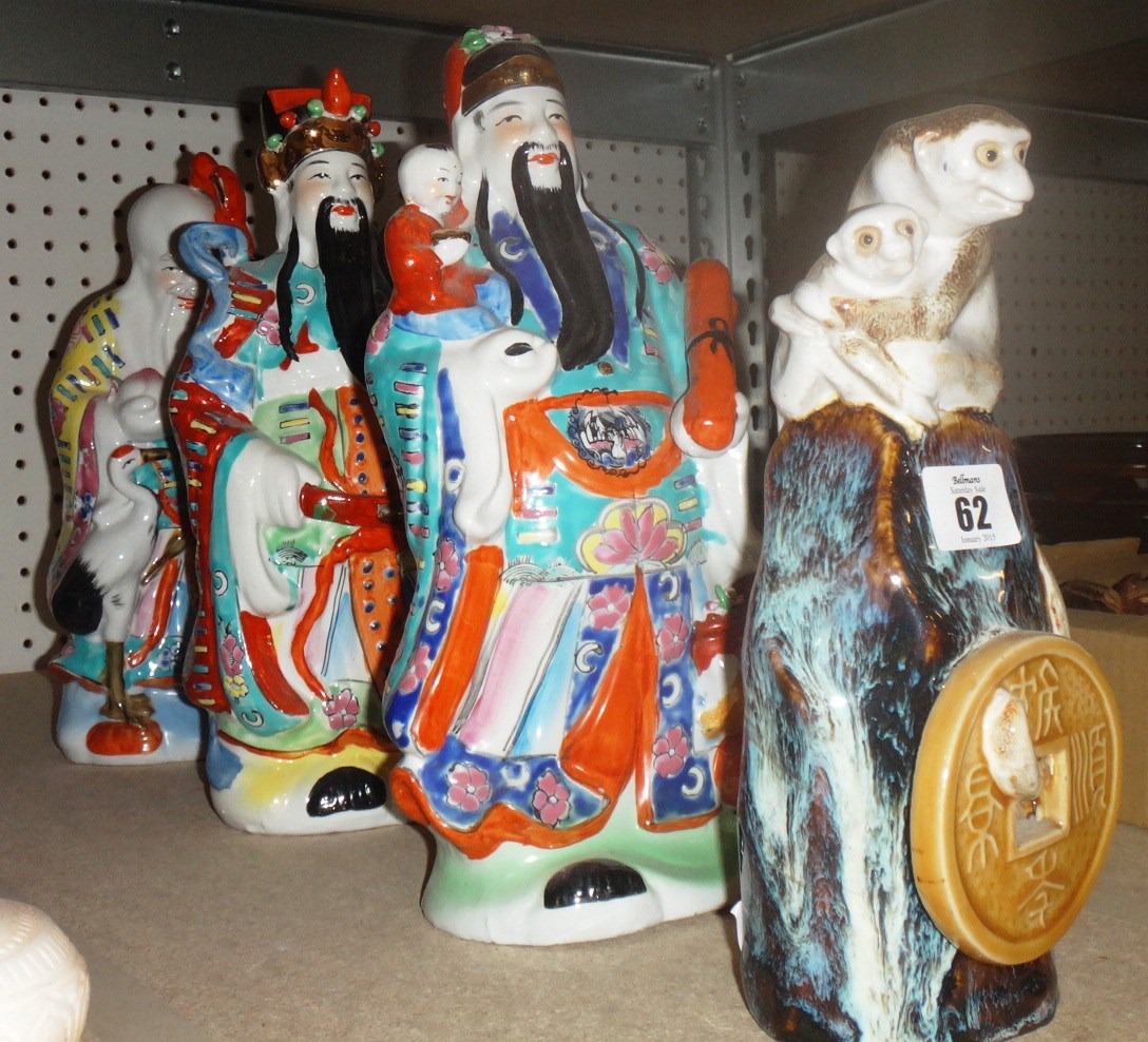 Appraisal: A group of three Oriental ceramic figures of immortals and