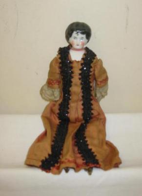 Appraisal: A china shoulder head doll with painted and moulded face