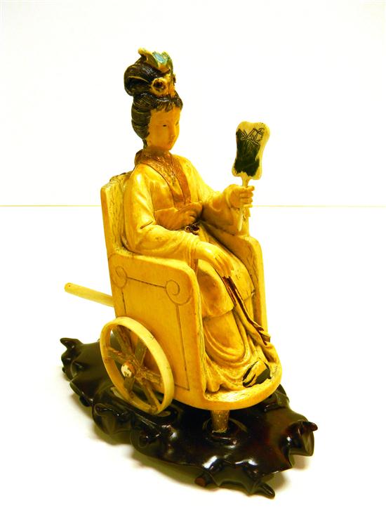 Appraisal: Chinese th C an ivory figure of a fan-wielding beauty