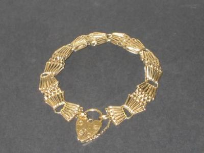 Appraisal: A CT GOLD GATE BRACELET the fancy links with heart