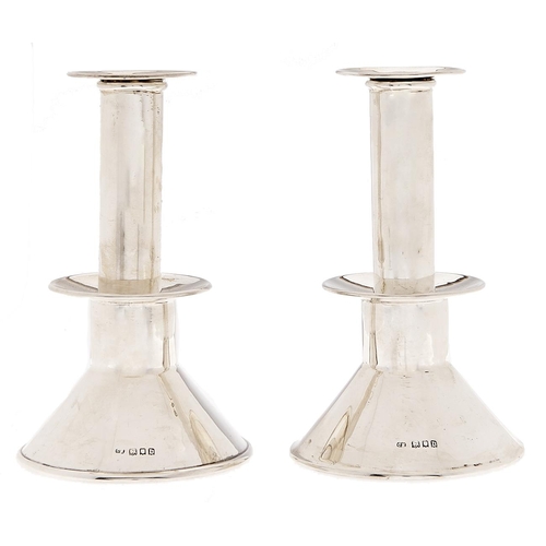 Appraisal: A pair of George V silver candlesticks with low drip